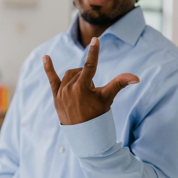 Person with a relaxed but focused expression in an office setting.