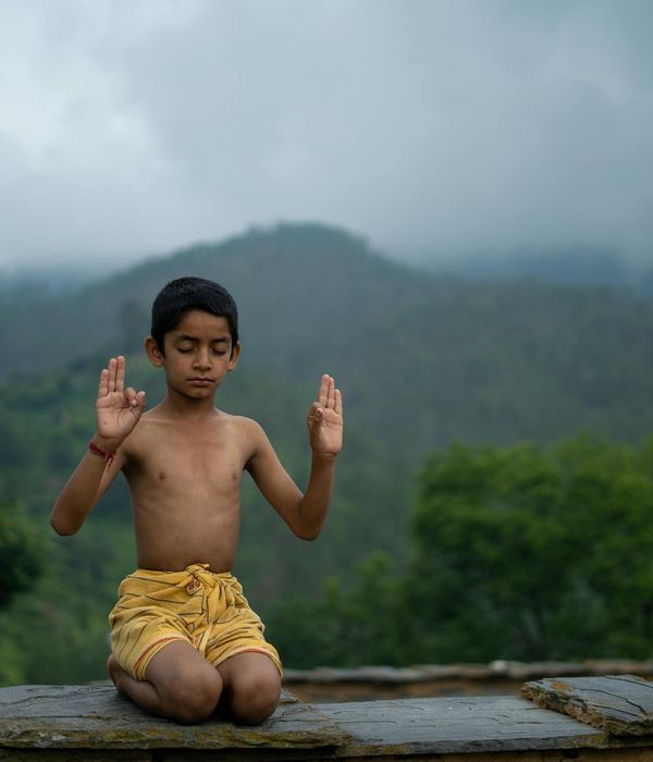 Woman practicing a peaceful yoga pose in a calm environment.
